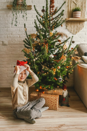 Little child near decorated Christmas tree, copy space.の写真素材