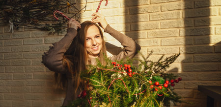 Beautiful woman near Christmas decoration, funnyの写真素材