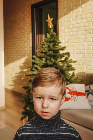 Little child and decorated Christmas tree, portrait.の写真素材