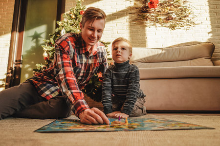 Happy family playing board game walkerの写真素材