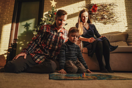 Happy family playing board game walkerの写真素材