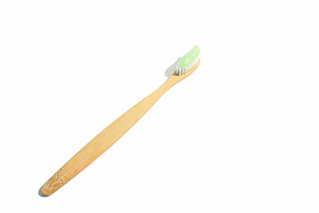 Natural bamboo toothbrush on white background isolated.の写真素材