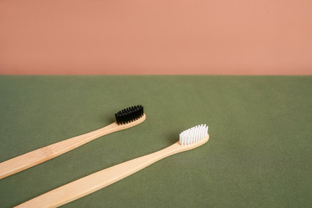 Natural bamboo toothbrush on green beige background.の写真素材