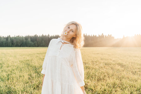 Portrait of a blonde woman in field.の写真素材