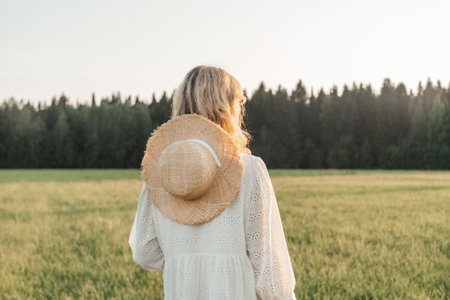 Portrait of a blonde woman in field.の写真素材
