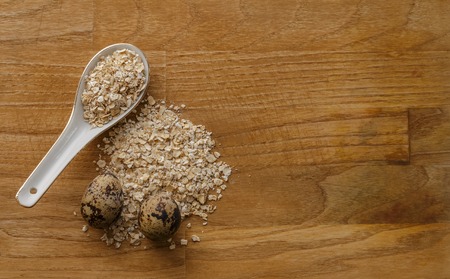 oatmeal and eggs wood texture top viewの写真素材