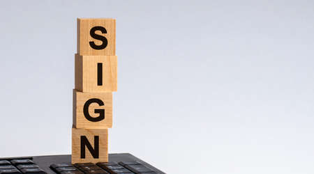 Wooden block with words HURT on wooden cubes, with the medical mask, health concept, yellow...