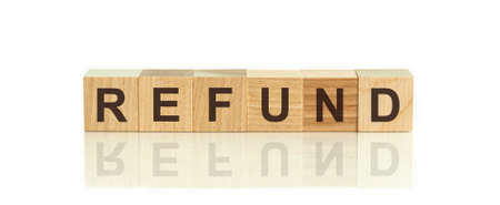 Letter block in word refund on wood white background.の写真素材