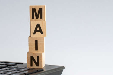 MAIN word made with building blocks on the black keyboard, white backgroundの写真素材