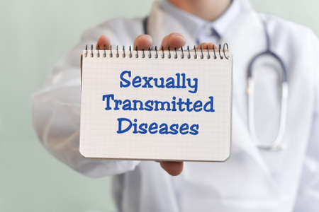 Doctor writing word Sexually Transmitted Diseases with blu marker, Medical conceptの写真素材