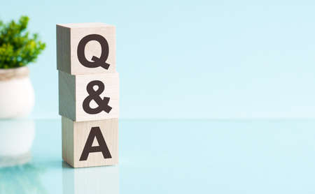 Letter of the alphabet of QA on a light blu background.の写真素材