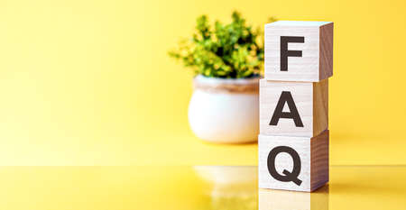 Letter of the alphabet of FAQ on a light yellow background. FAQ - Frequently Asked Questionsの写真素材