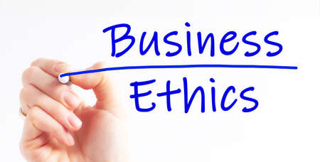 Hand writing inscription Business Ethics with blue marker, concept. Business Ethics, business concept background.の写真素材