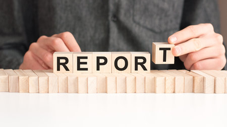 man made word Report with wood blocksの写真素材