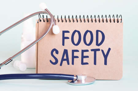 FOOD SAFETY - diagnosis written on a white piece of paper. Treatment and prevention of disease. Medical concept. Selective focusの写真素材