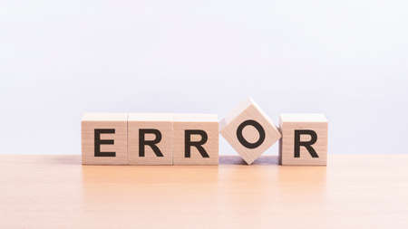 error - words from wooden blocks with letters, of inform brief concept, white background.の写真素材
