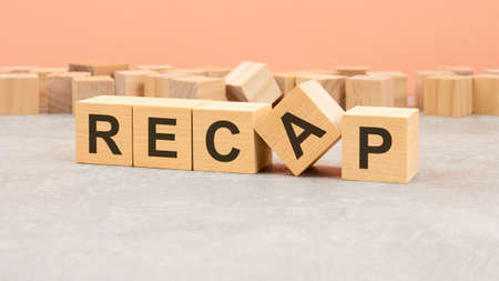word Recap made with wood blocks. text is written in black letters, light background, business conceptの写真素材