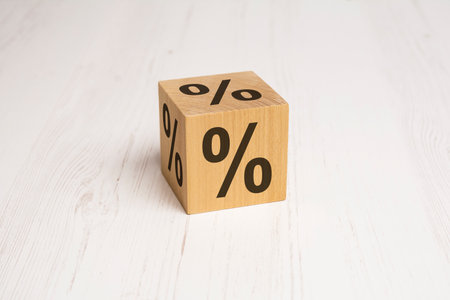 wooden cube with percent sign on white background. space for text.の写真素材