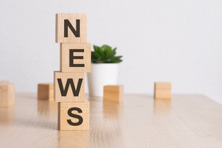 word NEWS with wood cubes, white backgroundの写真素材