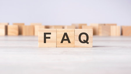 FAQ - acronym concept written on wooden cubes or blocks on a light gray backgroundの写真素材