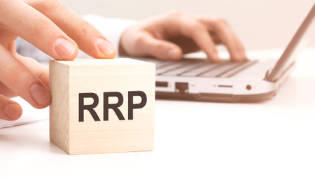 RRP text wooden block on white table background. Idea, strategy, advertising, marketing, keyword and content conceptの写真素材