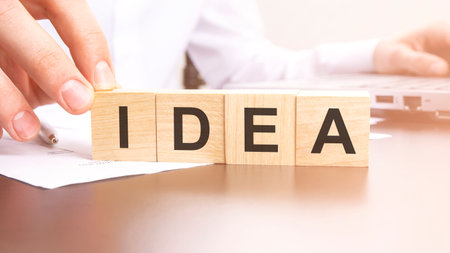 man made text IDEA with wood blocks on the background of the office table. selective focus. business concept.の写真素材