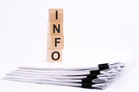 wooden cubes with text INFO on white tableの写真素材