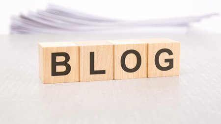blog word written on wood blocks with white backgroundの写真素材