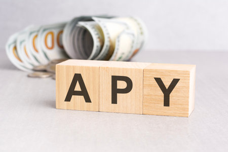 word APY on wooden cubes, gray background, business conceptの写真素材