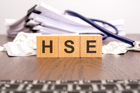 HSE - short for Health and Safety Executive - text on wooden cubes, medical conceptの写真素材