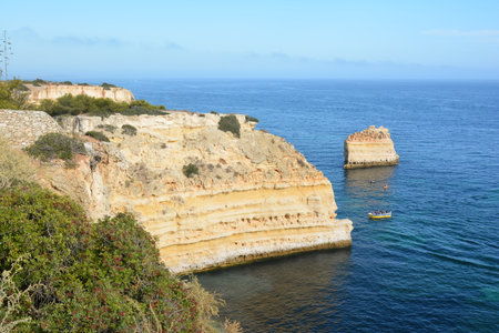 Front view of a stunning rocky landscape located near Lagoa in the Algarve region of Portugal.の写真素材