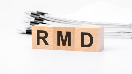 RMD wooden blocks word on white background. RMD - short for Required Minimum Distribution, business conceptsの写真素材