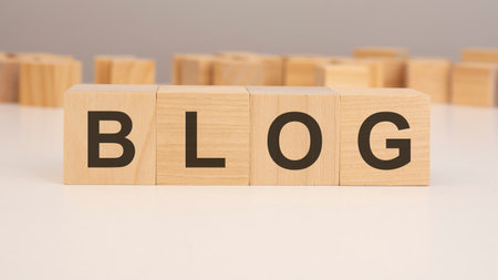 wooden blocks with text BLOG on wood white tableの写真素材