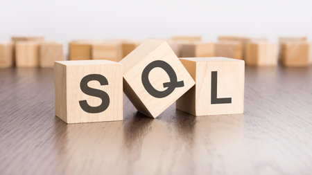 SQL text on wooden cubes. wooden background. foregroundの写真素材