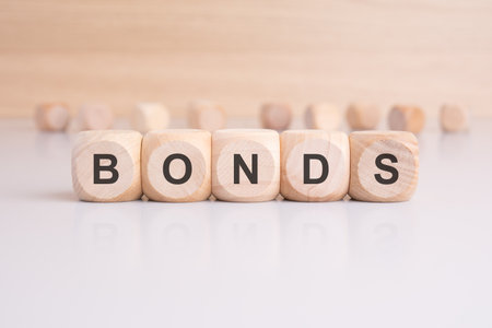 wooden cubes with letters form the expression BONDS. finance and business conceptの写真素材