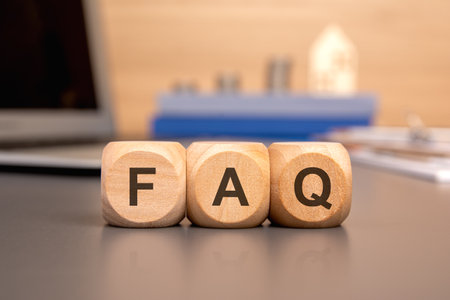 text FAQ on wooden cubes on office table with copy space, Frequency Asked Questions conceptの写真素材