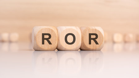 The wooden blocks showcase the letters ROR, featuring a reflective surface, representing various ideas and themesの写真素材