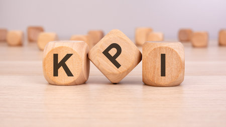 wooden blocks spelling KPI symbolizing key performance indicators, business metrics, and success trackingの写真素材