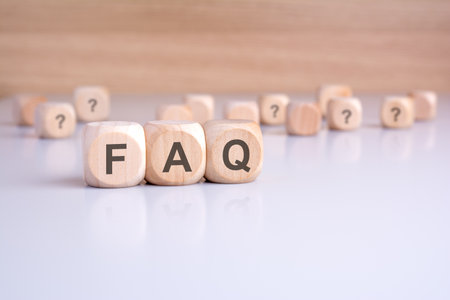 text FAQ on wooden cubes on office table with copy space, Frequency Asked Questions conceptの写真素材