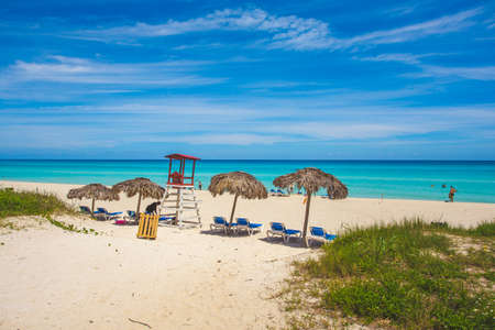Shaggy umbrellas with sun loungers by the ocean, Varadero, Cubaの写真素材