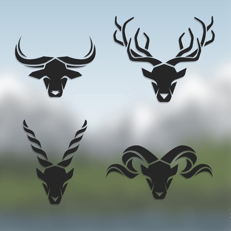 Logos horned animals. On blurred background. Buffalo deer mountain goat mountain sheep.のイラスト素材