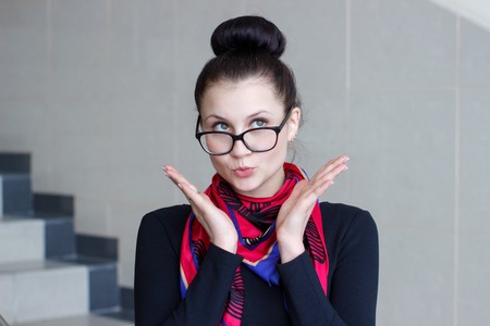 Portrait of a beautiful brunette girl with a surprised lookの写真素材