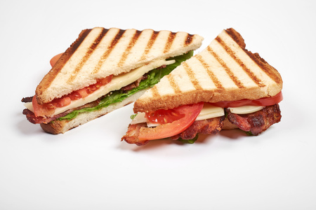 fresh sandwich close up with vegetables and meat isolated on white backgroundの写真素材