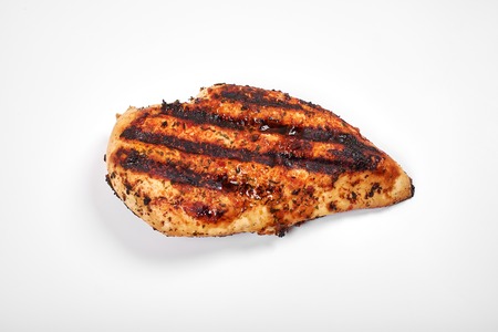 Chicken meat. Grilled fillet pieces isolated on white background.の写真素材