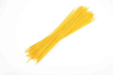 Uncooked pasta spaghetti macaroni isolated on white backgroundの写真素材