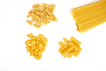 Different types of pasta isolated on whiteの写真素材