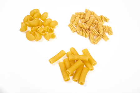 Different types of pasta isolated on whiteの写真素材