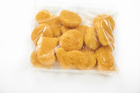 chicken nuggets in the package, isolated on white backgroundの写真素材