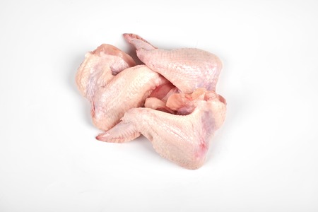 Raw chicken wings isolated on white background