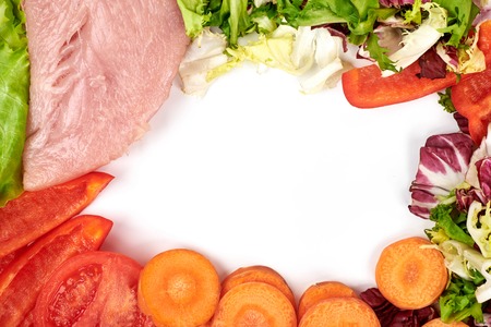 Frame of fresh vegetables and dietary meat isolated on the white background. Healthy natural food with copy space . Cooking ingredients top view, mockup for recipe or menu.の写真素材